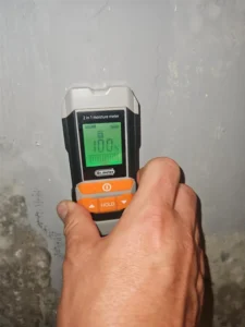 Home inspector checking for hidden moisture in a Charlotte bathroom