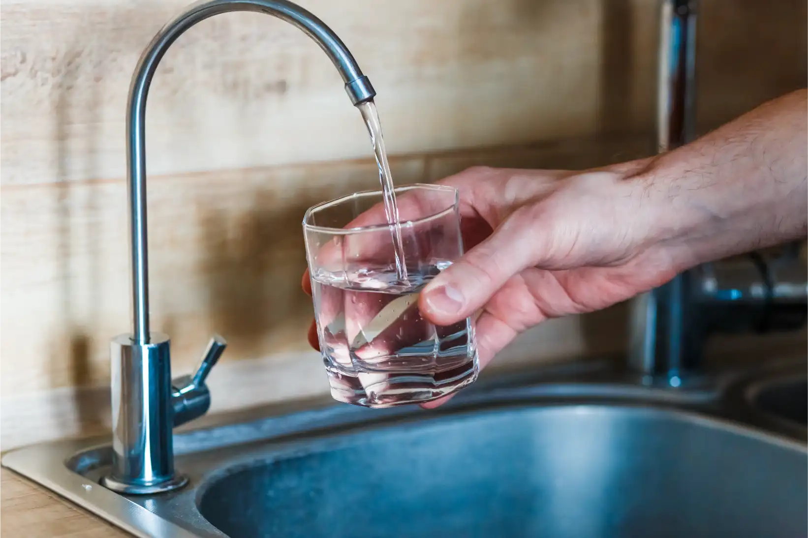 Filling glass with tap water